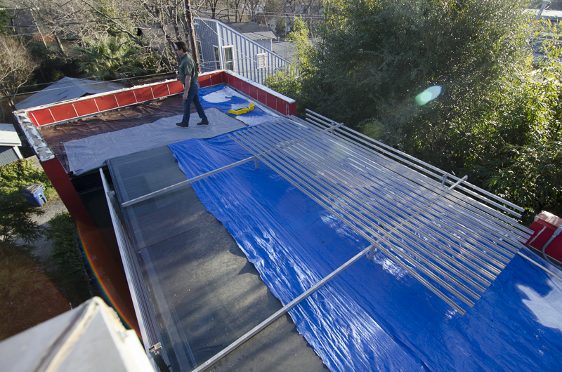 Flat Roof Being Worked On By Professionals