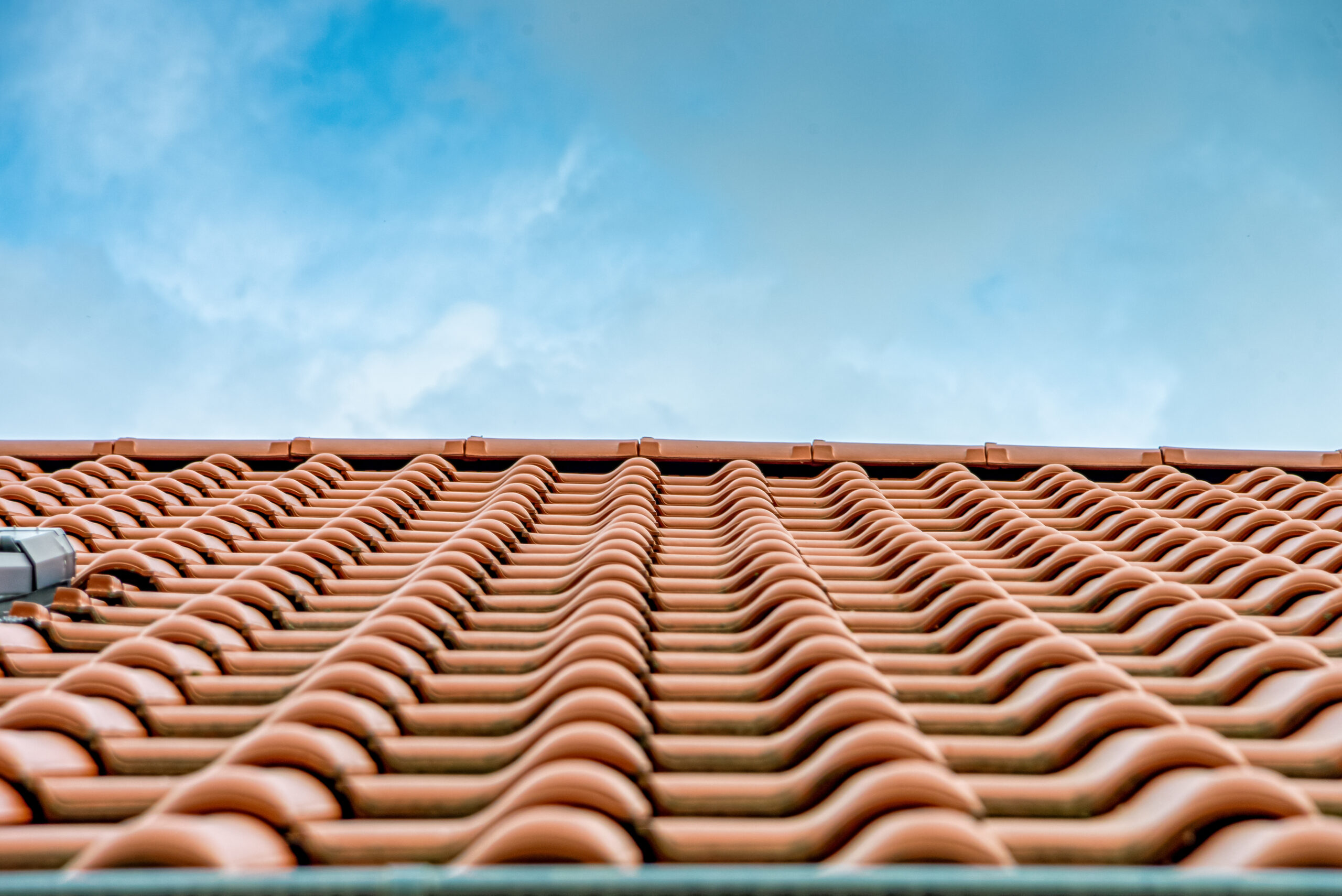 Close View Of Red Tile Roof On Home